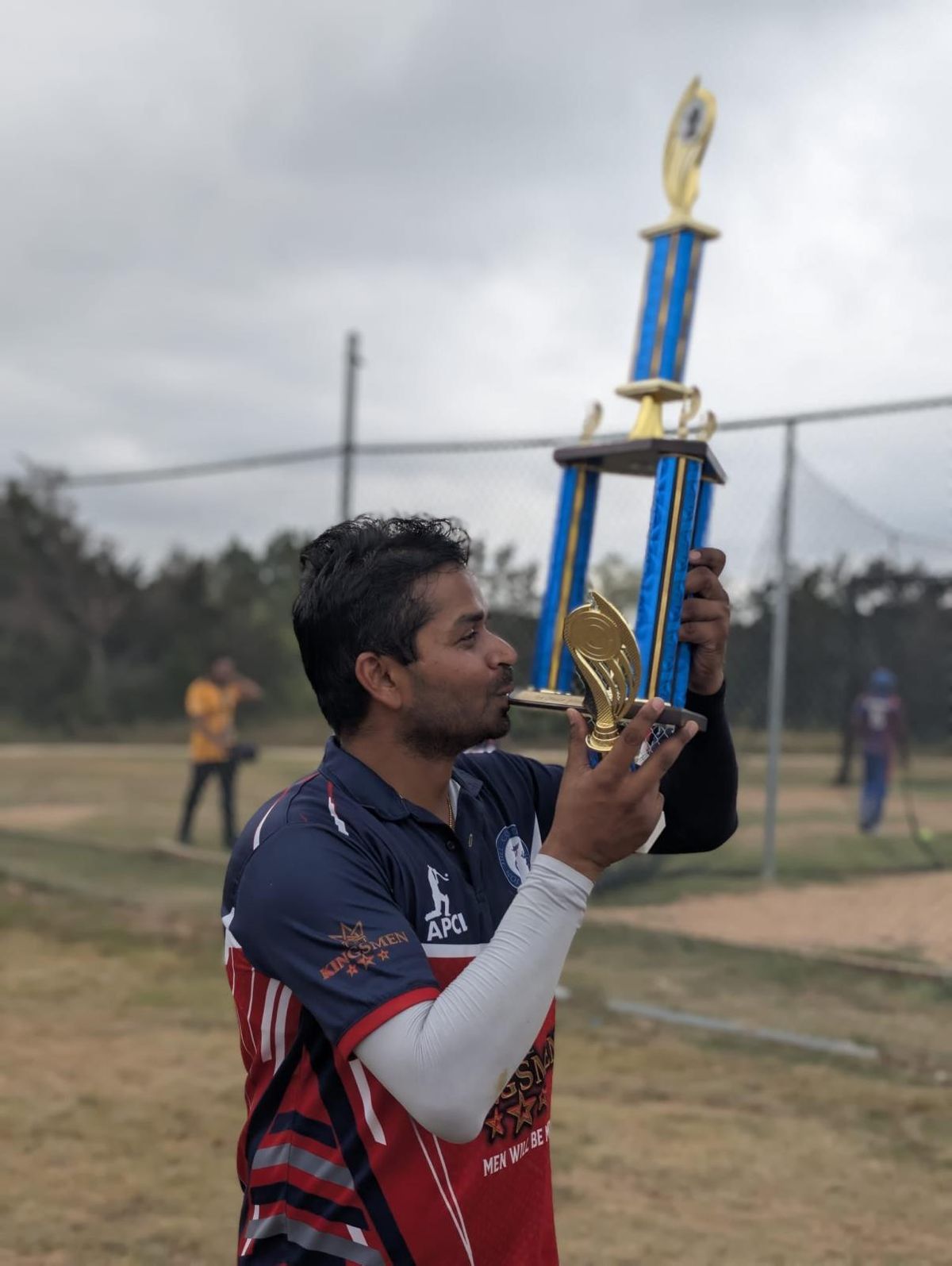 Men will be Men, Kingsmen! — Captain Akash kisses the Plate trophy.
