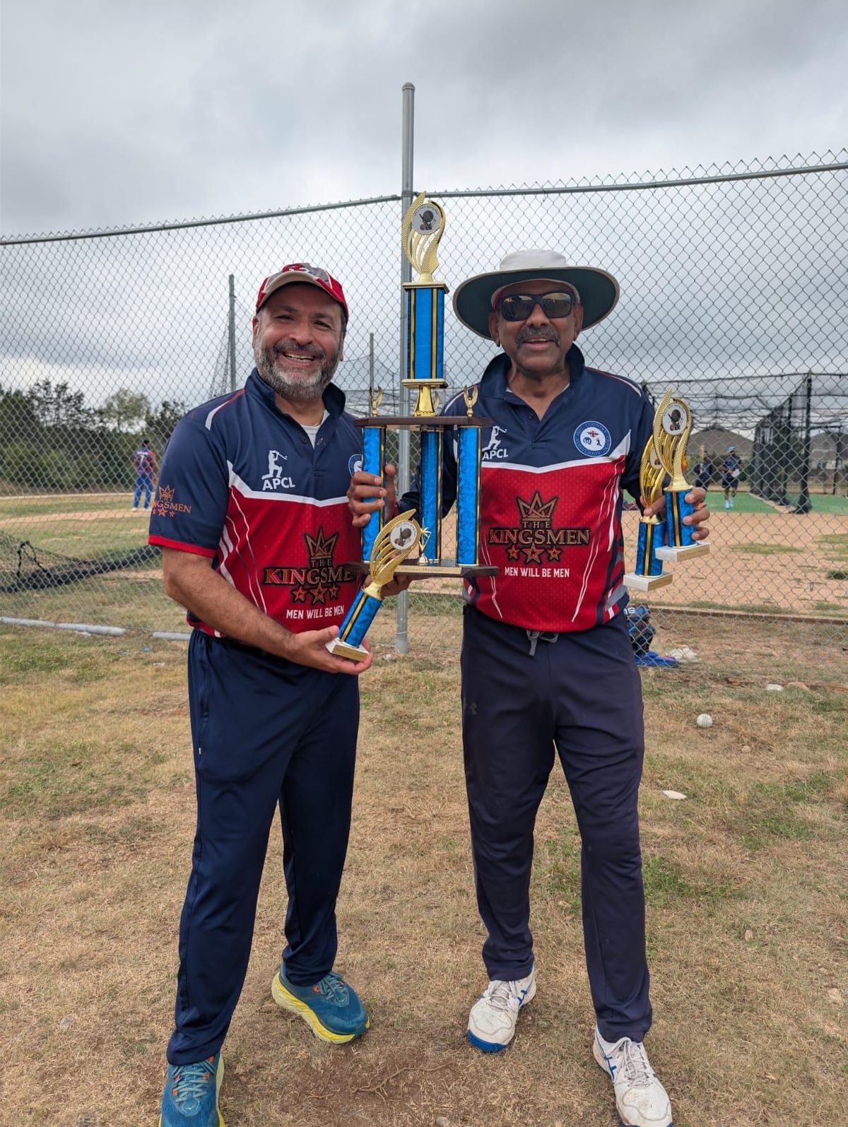 Two HCCA stalwarts — Sanjay (founder & 2024–25 President) with Hemant, honoring Player of the Match.